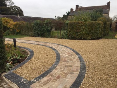 Gold gravel driveway with paved pathway in Somerset